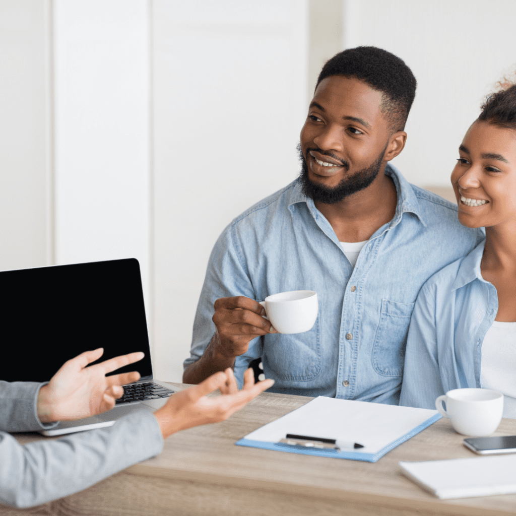 Couple at desk with cup